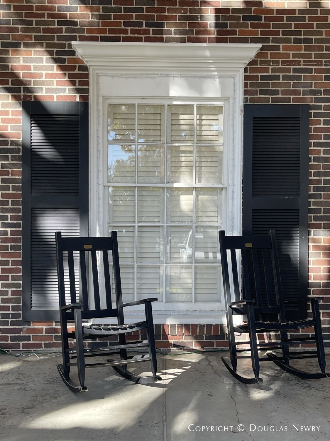 Front porch chairs show neighborhood feel of sorority house at SMU.