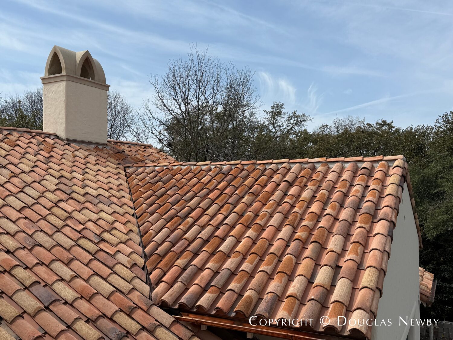 Deep barrel tile roofs are indicative of Spanish Revival style homes like this one at 4400 Belfort Place, Highland Park, Dallas, Texas.
